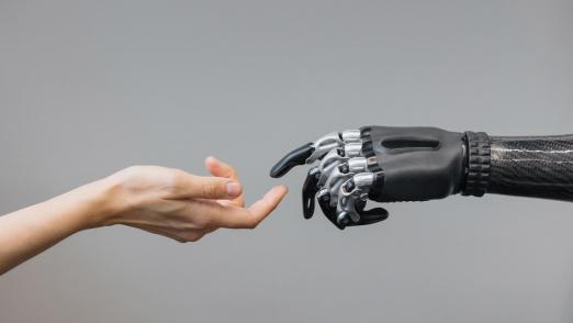 the human hand and the siber hand bionic prosthesis make a handshake and greeting. modern technologies of prosthetics of limbs of hands and feet. full life of people with amputated limbs. black bionic